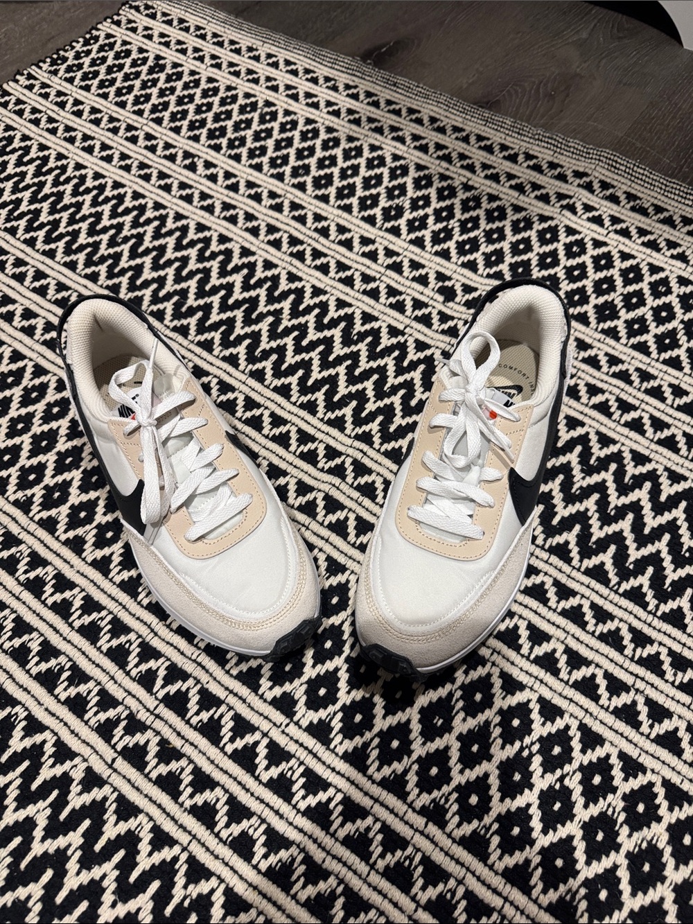 Nike Women's White Beige Sneakers with Black Swoosh